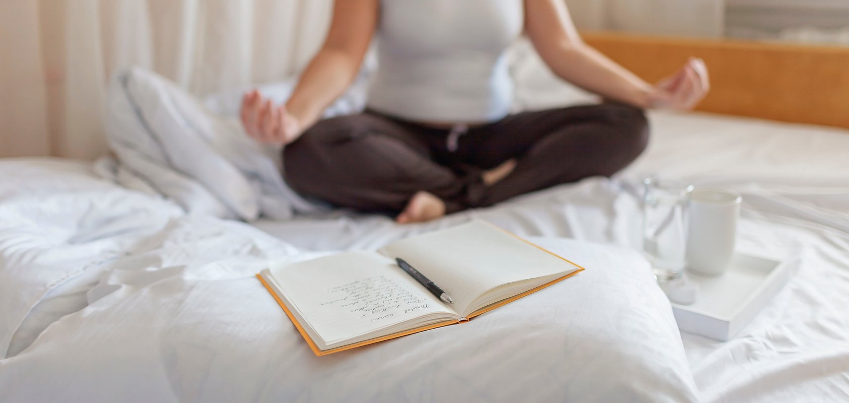 Woman Meditating in Bed Following Her Mental Care List